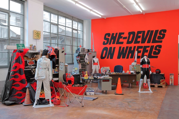 Sylvie Fleury "She-Devils On Wheels" Headquarters 1997. Vue d’intstallation, «Paillettes et Dépendances ou la fascination du néant», installation view, MAMCO Geneva, 2008 Collection Migros Museum © Photo: Yves-Marie Kalkinnen